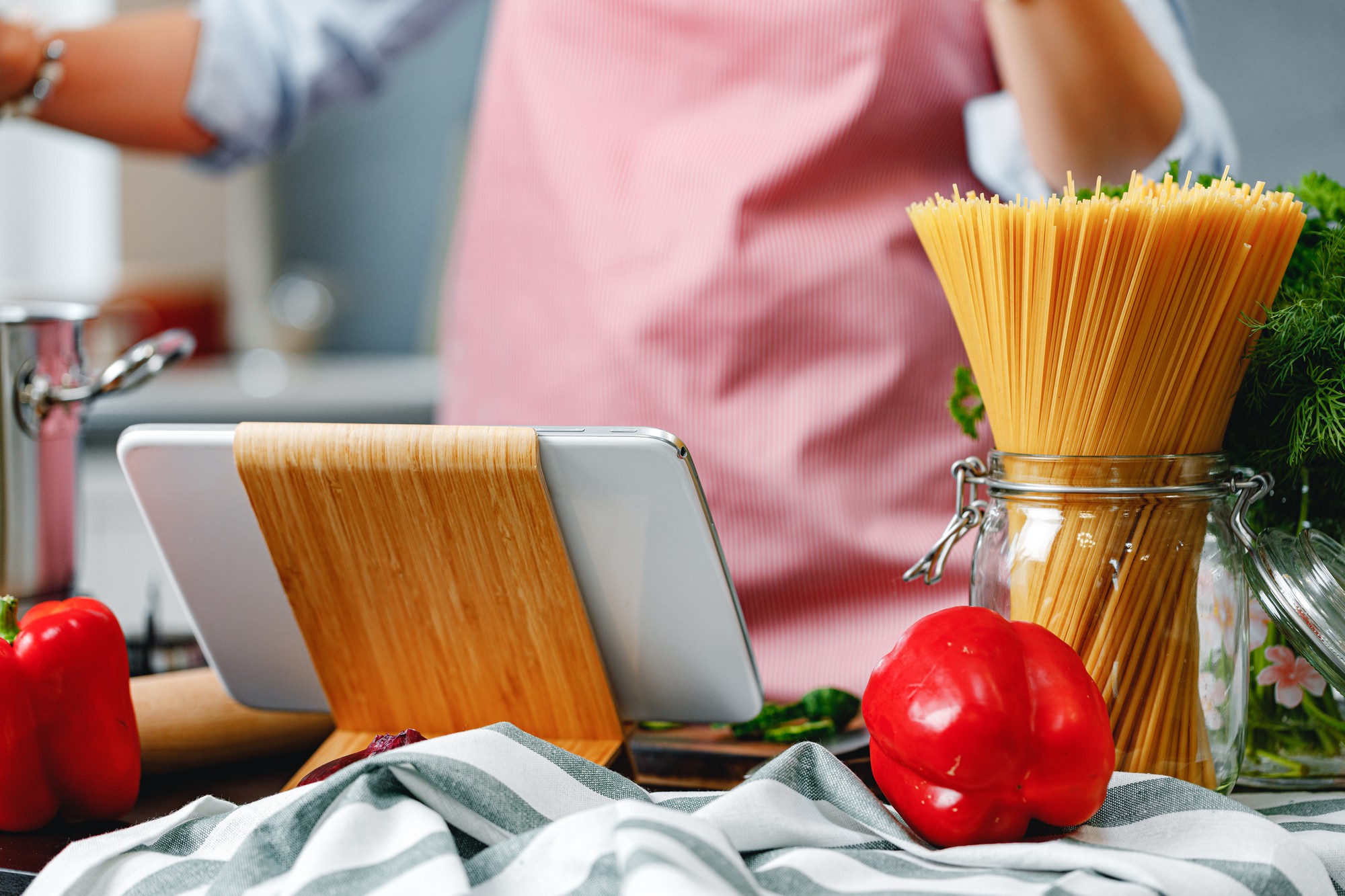 Kitchen workspace with utensils and laptop